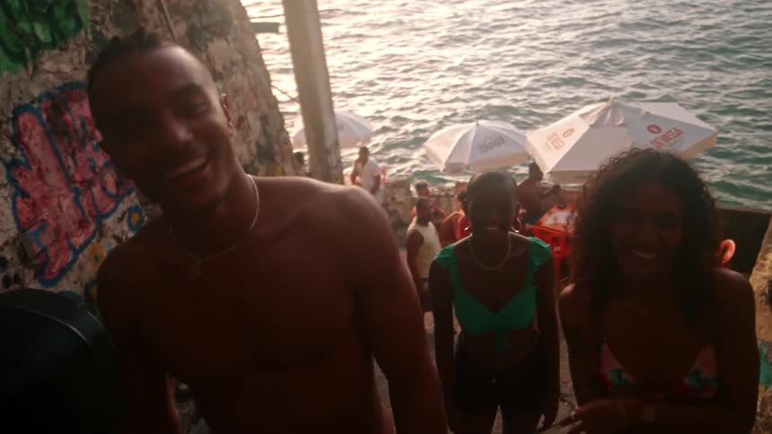 People are partying by the shore