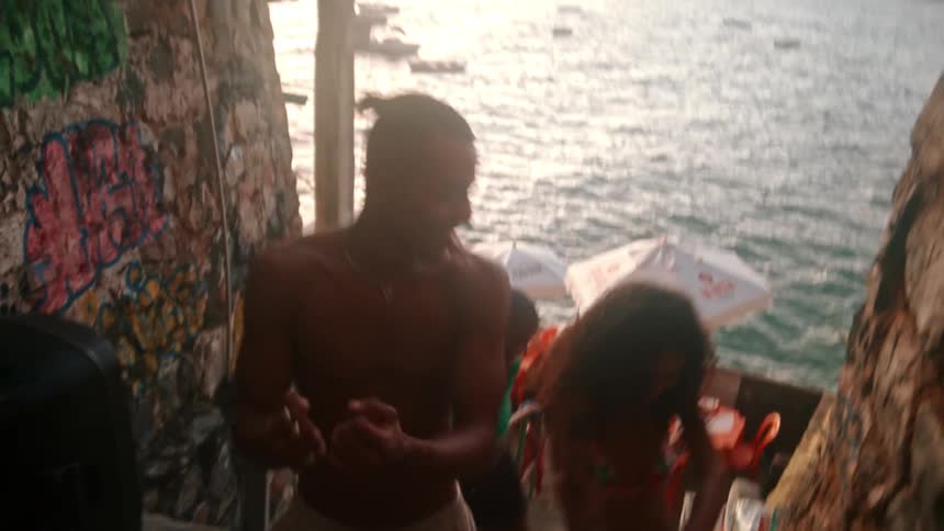Friends dance together on the steps