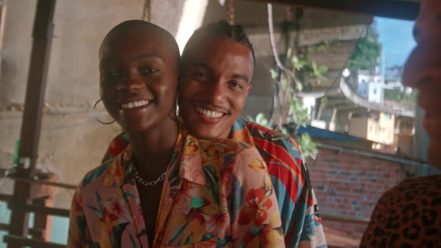 Couple hugs and dances closely with gentle smiles