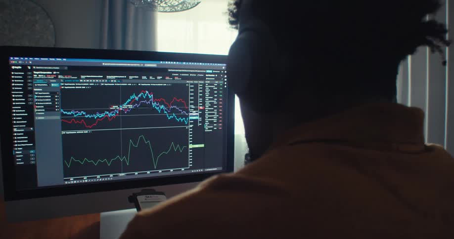 A man looks at a computer screen