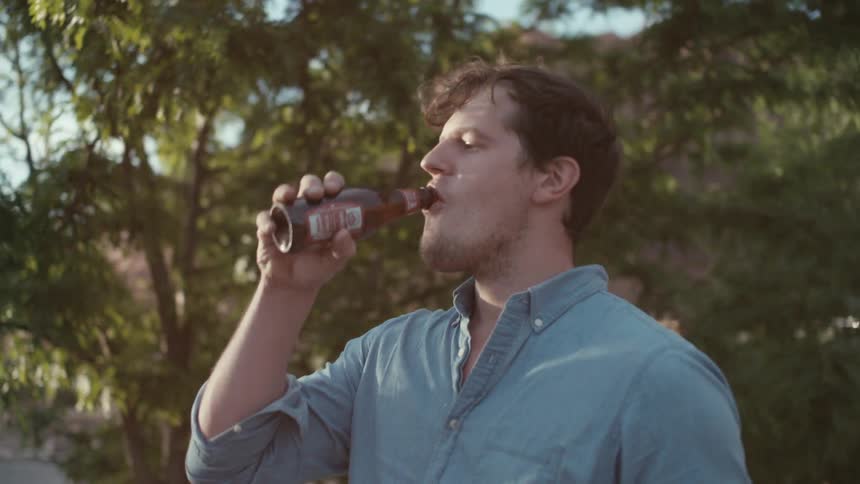 A person opening a bottle