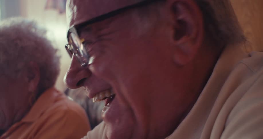 Elderly couple having fun playing video games