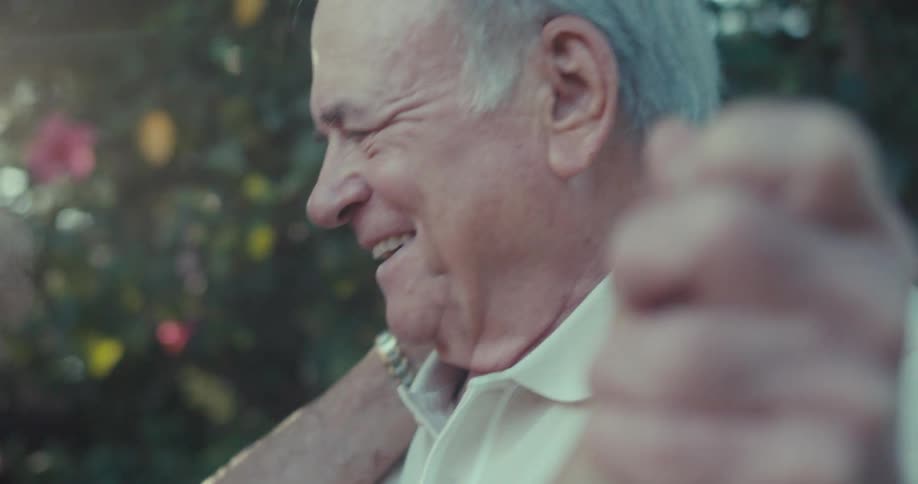 An elderly couple dance