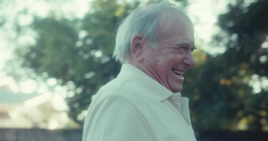 An elderly couple dance