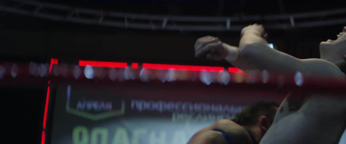 A wrestler gets chopped in the ring