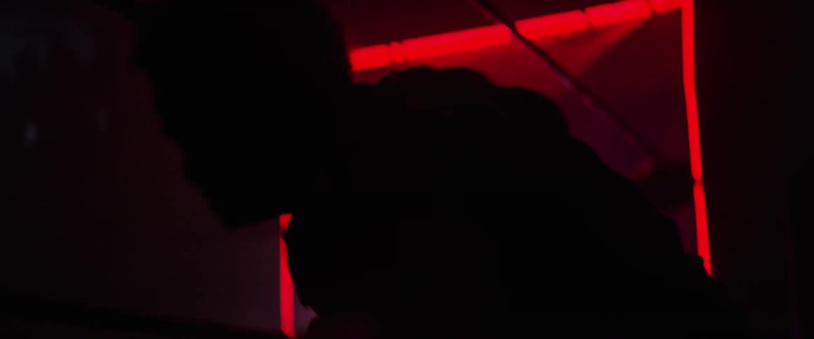 A wrestler getting into the ring