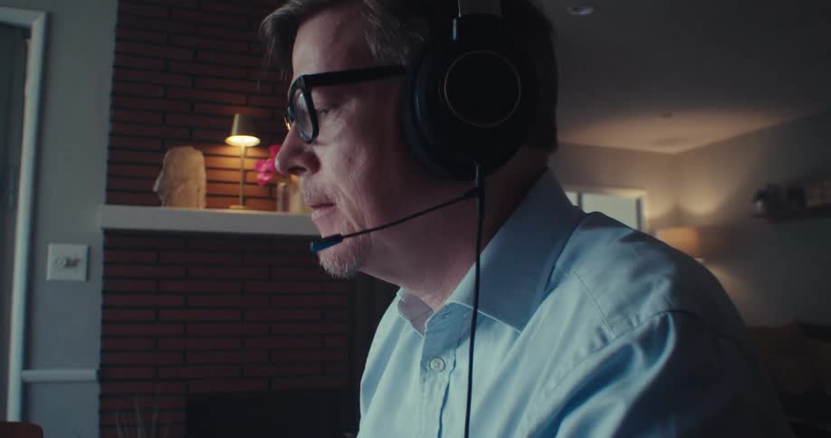 The man is nodding at his laptop