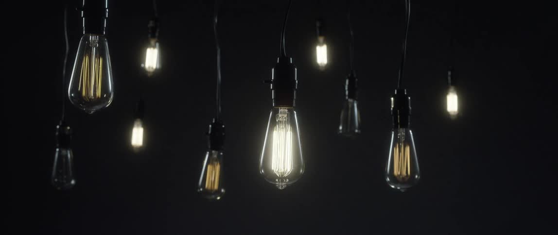 Lightbulbs hang from the ceiling and turn on and off