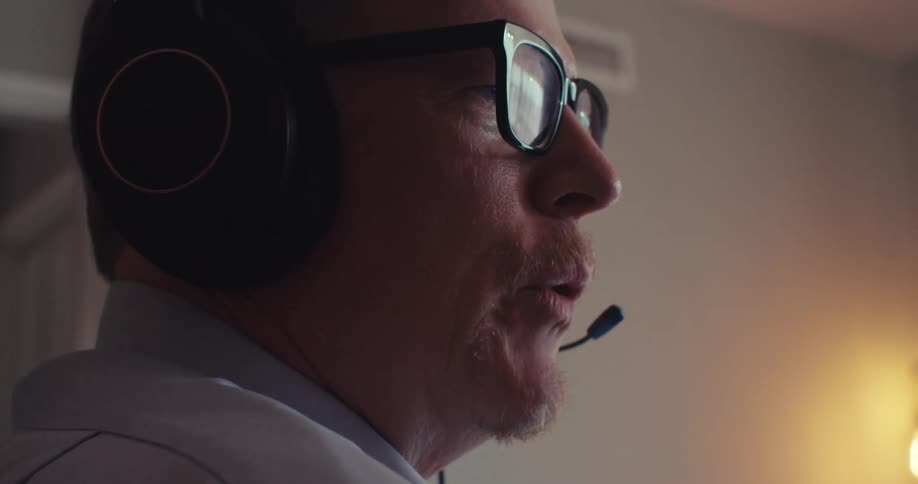 A man talks through his headset
