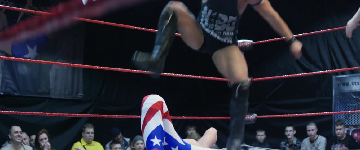 Two wrestlers are having a match
