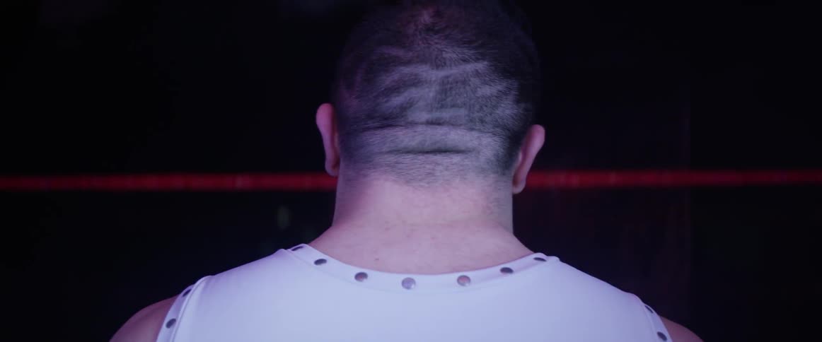 Back of a man's head with lights flashing