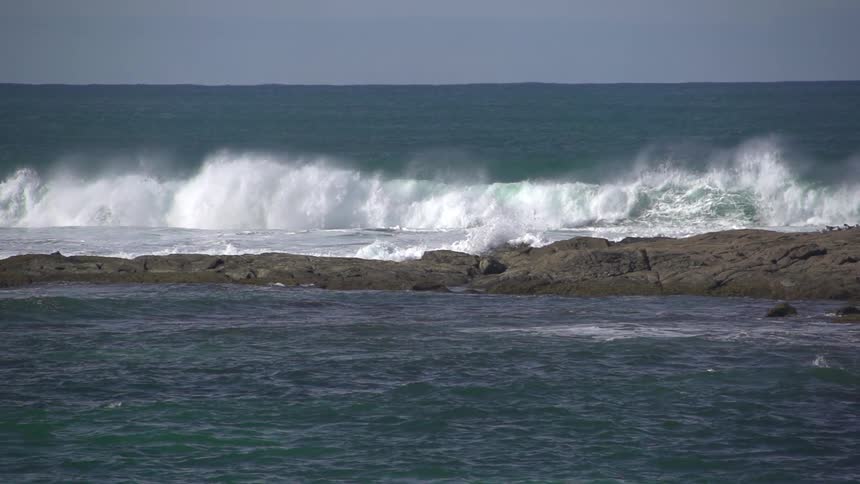Waves crashing onto some rocks