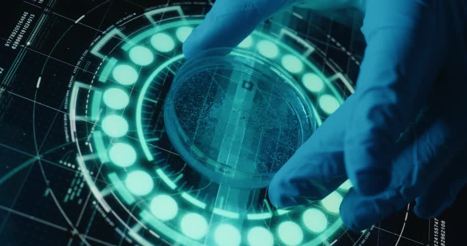 Person wearing a glove adjusts a petri dish sitting in the center of a animated digital graphic