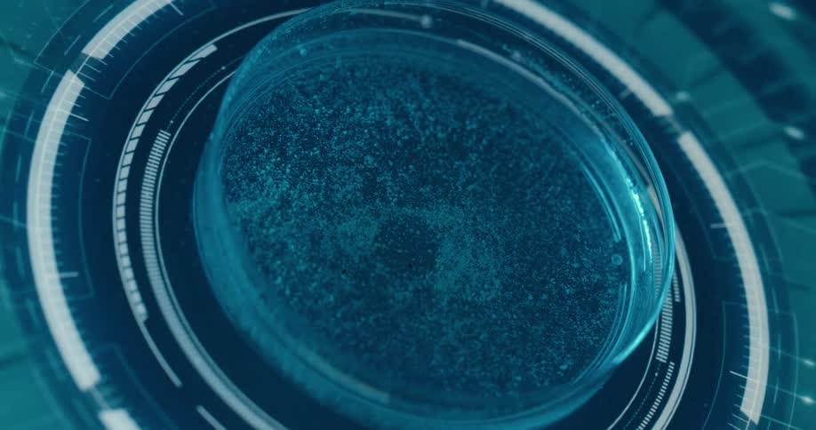 A close view shows a petri dish with a blue liquid and small particles with a pipette above it set against a background of concentric glowing blue circles and digital elements