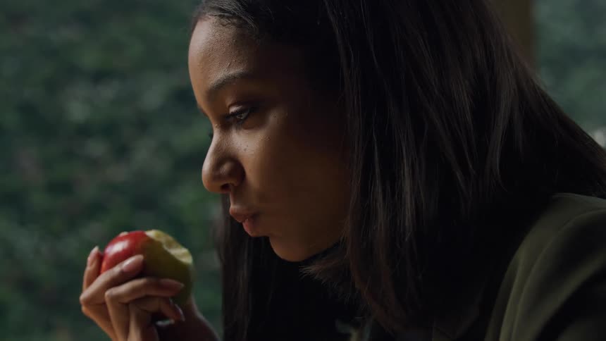 A woman eating an apple