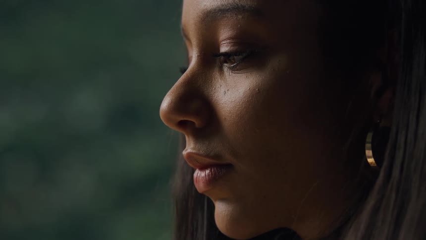 The woman taps her face to stay awake