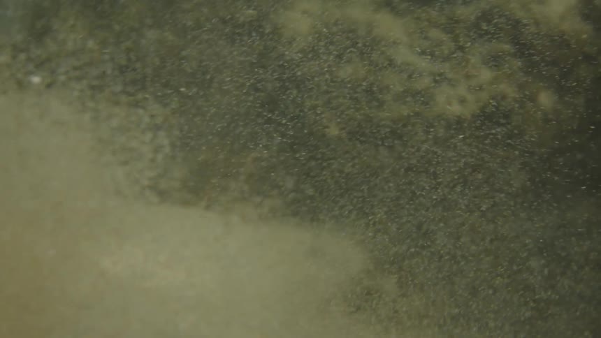 Kicking up dust underwater