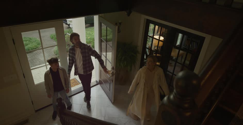 Family consisting of a child entering the house