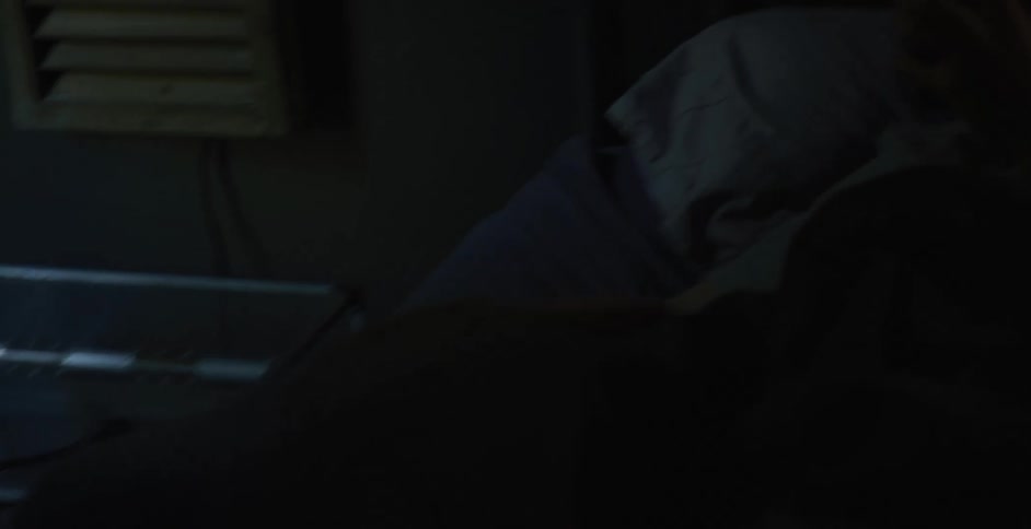 A boy checks his phone and wakes up