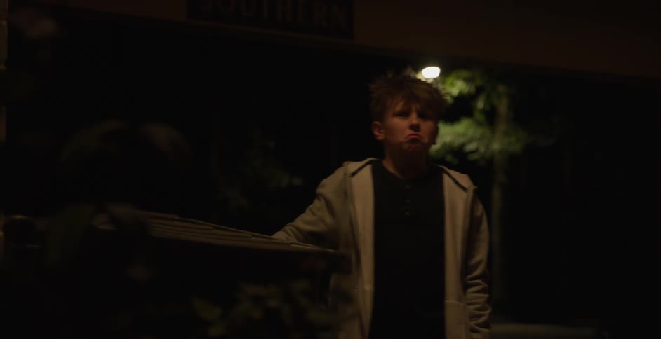 Little scared boy throwing trash