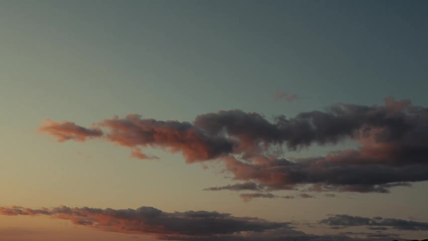 Sunset paints the clouds