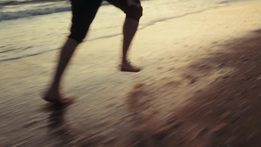 The man is running on the beach
