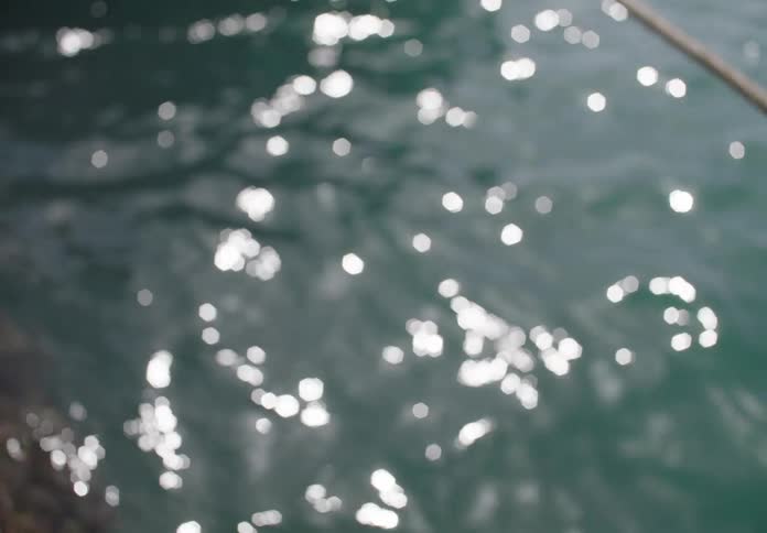 A pool of water shows a ripple effect caused by the wind around midday