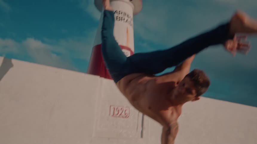 A man does a halfcartwheel