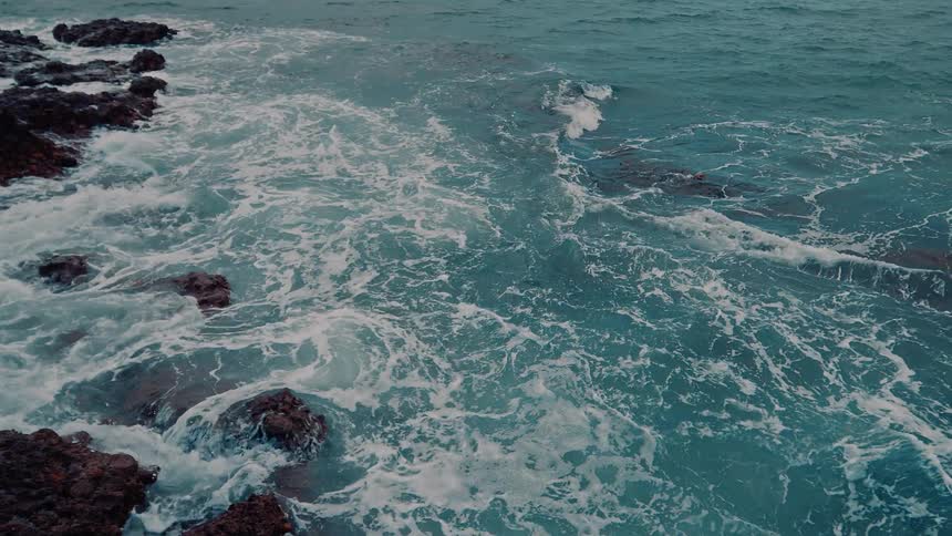 Rough ocean amid rocks