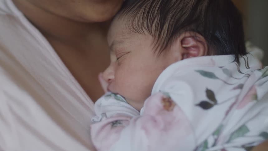Mother with a baby on her lap