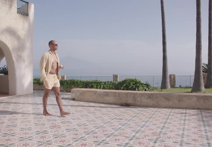 A man walks barefoot