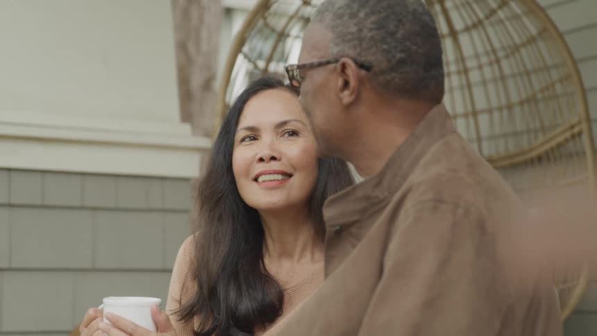 Couple sitting in a room talking