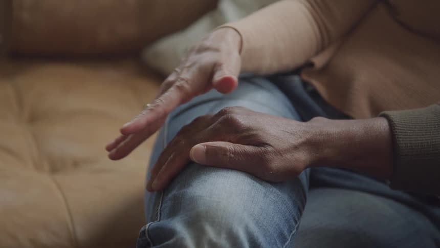 Two people holding hands