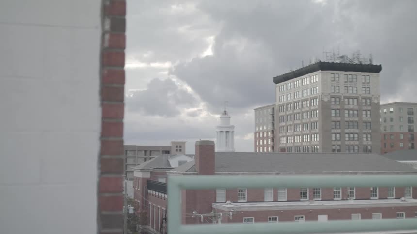 Heavy clouds are above the buildings