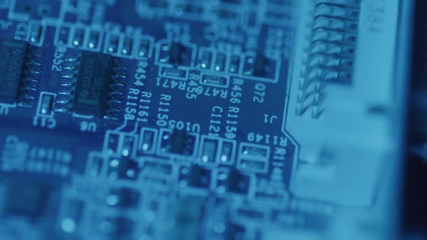 Blue light on a board with computer circuits