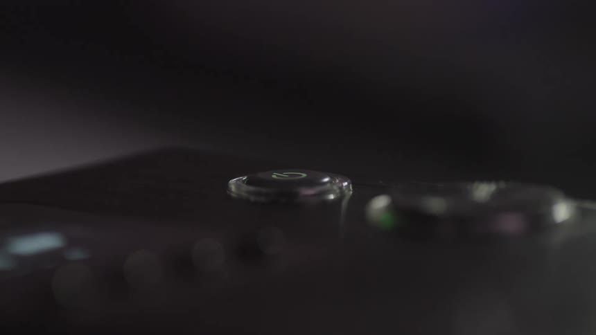 Finger clicking a button on a device