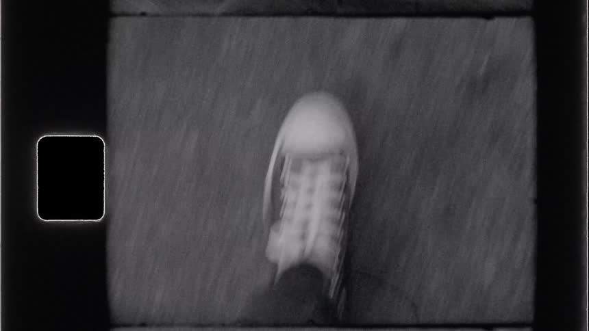 A person strides forward in crisp white sneakers laced neatly