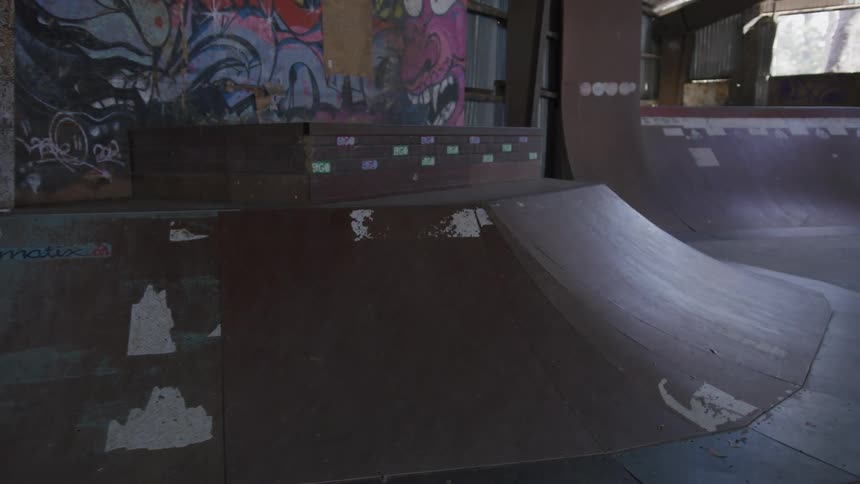 Graffiti is on the wall of the skate park