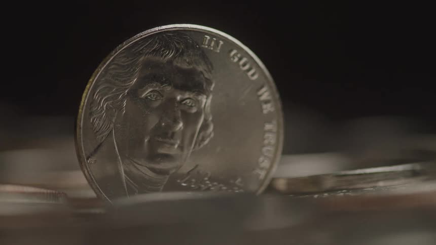 The stack of coins spins