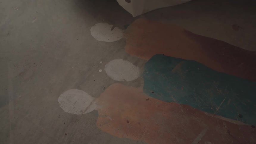 Artistic drawing of people silhouettes on a wooden surface