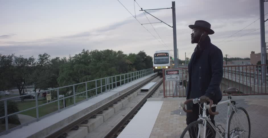A man waits for a train