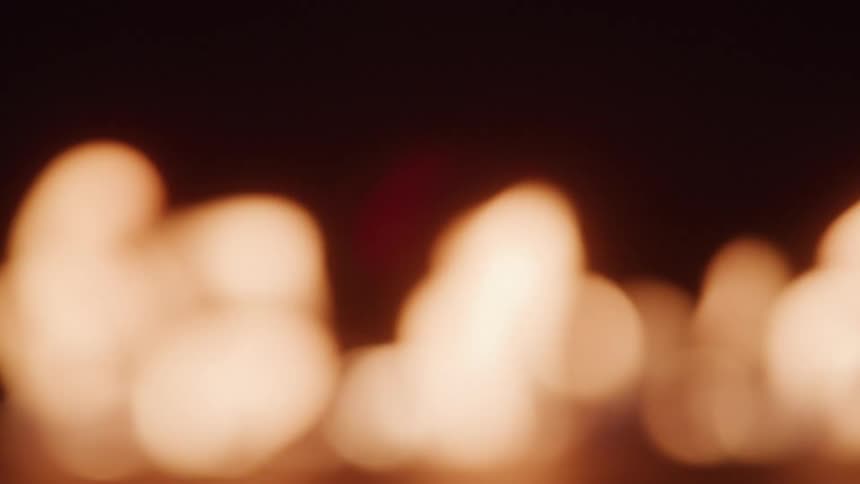 View of fire flame blurring against a black background