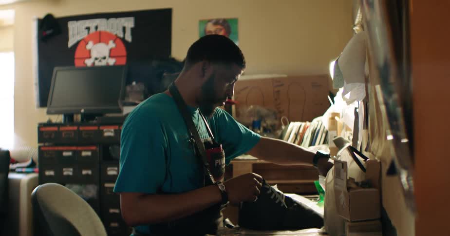 Man in apron working with fabrics