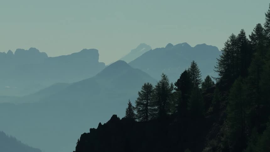Vast Landscape with Silhouetted Mountain Range and Long Lens Parallax Effect
