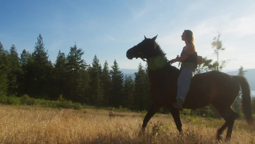 The woman turns on her horse and rides off