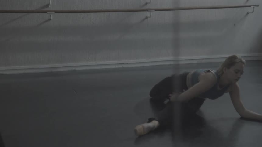 The woman is doing a split