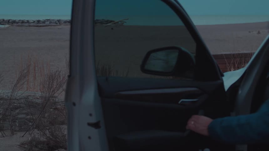 A man gets into his car