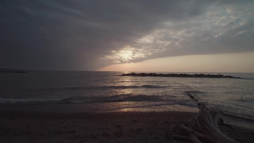 Deserted beach on a cloudy dawn