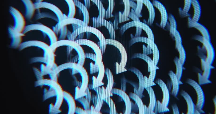 A kaleidoscopic spiral or prism effect of rotating loading or refreshing arrows creates a hypnotic abstract pattern while the user of the computer program is waiting due to a slow internet connection causing long waiting time
