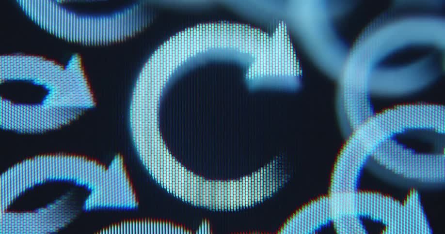 Macro close up of a digital device screen with RGB pixels displaying multiple spinning redo icons as time slows down and progress is being made while the computer program or Artificial Intelligence is loading and searching for results